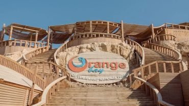 Orange Bay Island Hurghada Red Sea Snorkeling adventure in Orange Bay Island Hurghada Relaxing on the beach at Orange Bay Island Hurghada Boat trip to Orange Bay Island Hurghada Turquoise water and coral reefs at Orange Bay Island Families enjoying snorkeling in Orange Bay Island Hurghada Scenic sunset view at Orange Bay Island Hurghada Visitors swimming in crystal-clear waters at Orange Bay Island Soft white sand beaches at Orange Bay Island Hurghada Tropical fish and colorful coral in Orange Bay Island Hurghada